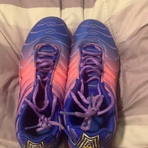 Blue,purple,and pink Nikes.